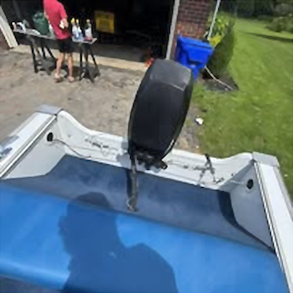 Clean blue boat floor and outboard motor