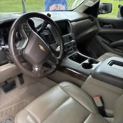 Clean leather driver's seat and dashboard in an SUV